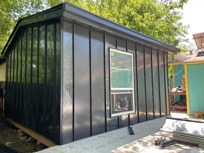 Black standing seam metal wall panels for Roof Inspection in Harvard