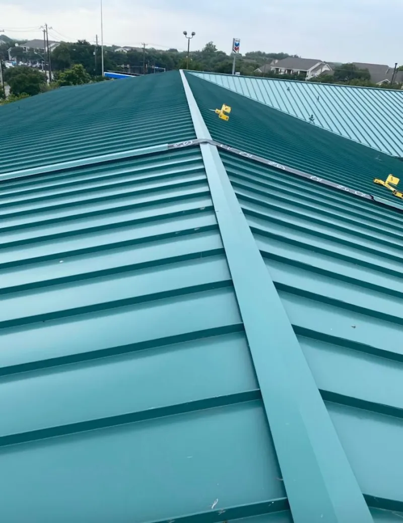 Green commercial metal roof ridge and valley for Metal Roof Repair in Harvard